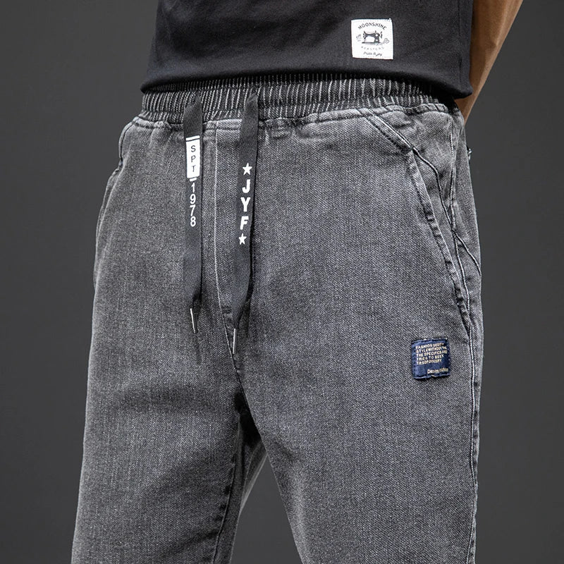 Primavera Verano negro azul Cargo Jeans hombres ropa de calle Denim Jogger pantalones hombres holgados Harem Jean pantalones de talla grande