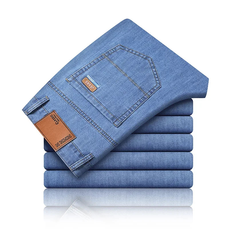 Nuevos pantalones vaqueros finos de seda de hielo para hombres, pantalones de algodón elásticos rectos azules, pantalones ligeros informales de negocios para primavera y verano