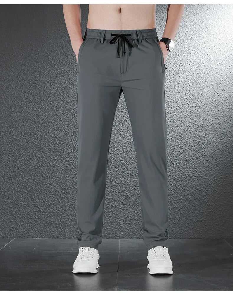 Pantalones informales finos de tela de seda de hielo suave para hombre, pantalón recto de estilo coreano, de alta elasticidad, marca de lujo, verano 2024