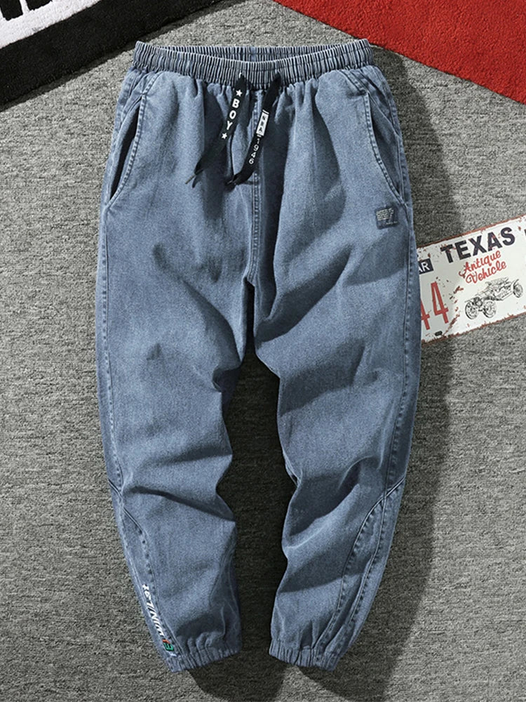 Pantalones vaqueros para correr de talla grande para hombre, ropa de calle 6XL 7XL 8XL, pantalones Cargo de mezclilla informales en negro y azul, pantalones vaqueros cónicos de algodón elásticos, pantalones holgados