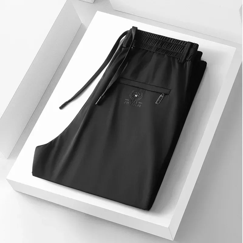 Pantalones informales finos de tela de seda de hielo suave para hombre, pantalón recto de estilo coreano, de alta elasticidad, marca de lujo, verano 2024