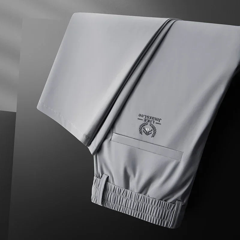Pantalones informales finos de tela de seda de hielo suave para hombre, pantalón recto de estilo coreano, de alta elasticidad, marca de lujo, verano 2024