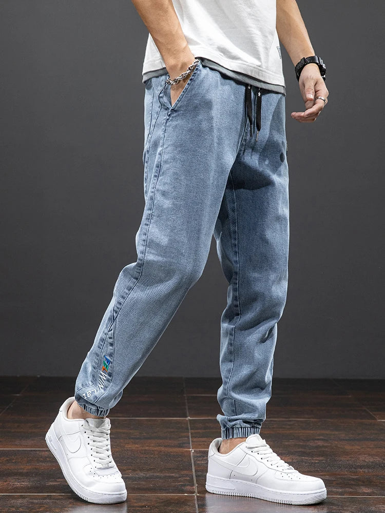 Primavera Verano negro azul Cargo Jeans hombres ropa de calle Denim Jogger pantalones hombres holgados Harem Jean pantalones de talla grande