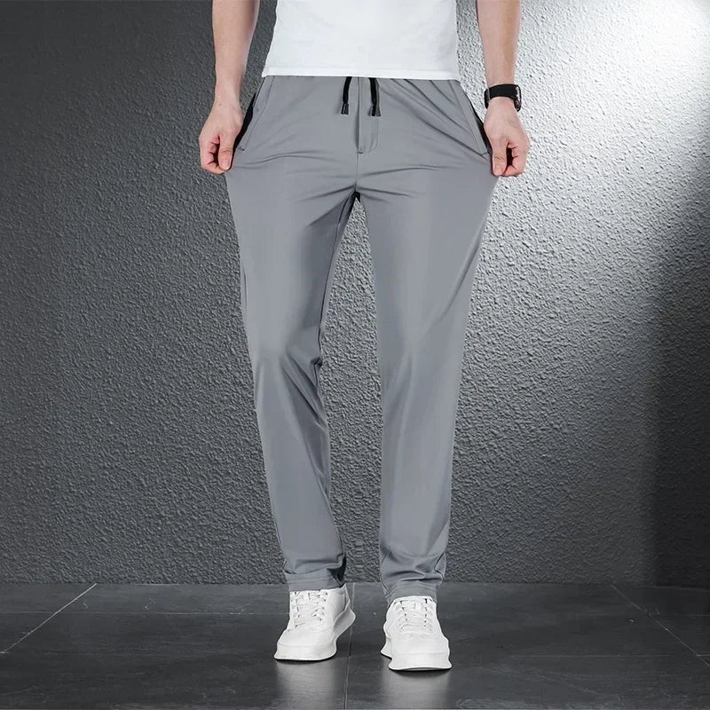 Pantalones informales finos de tela de seda de hielo suave para hombre, pantalón recto de estilo coreano, de alta elasticidad, marca de lujo, verano 2024