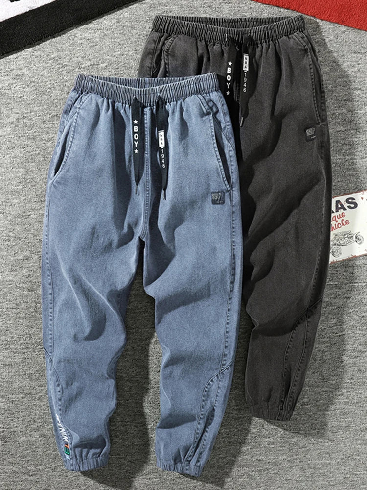 Pantalones vaqueros para correr de talla grande para hombre, ropa de calle 6XL 7XL 8XL, pantalones Cargo de mezclilla informales en negro y azul, pantalones vaqueros cónicos de algodón elásticos, pantalones holgados