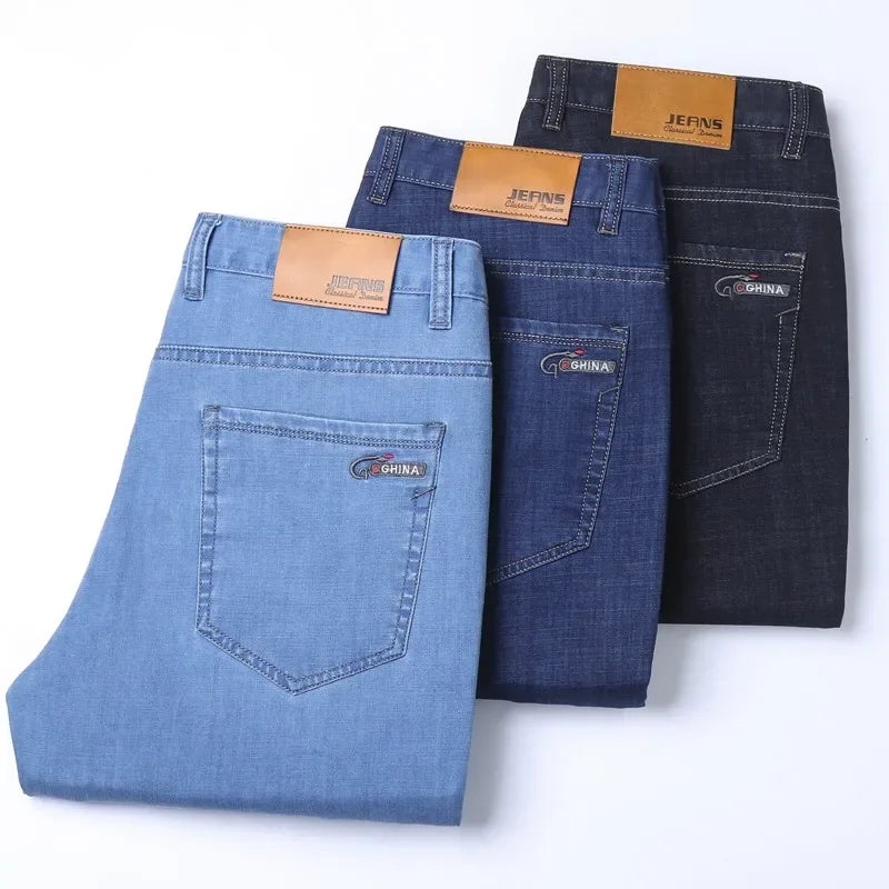 Nuevos pantalones vaqueros finos de seda de hielo para hombres, pantalones de algodón elásticos rectos azules, pantalones ligeros informales de negocios para primavera y verano